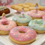 Colorful Barbie doughnuts with pink glaze and vibrant sprinkles.